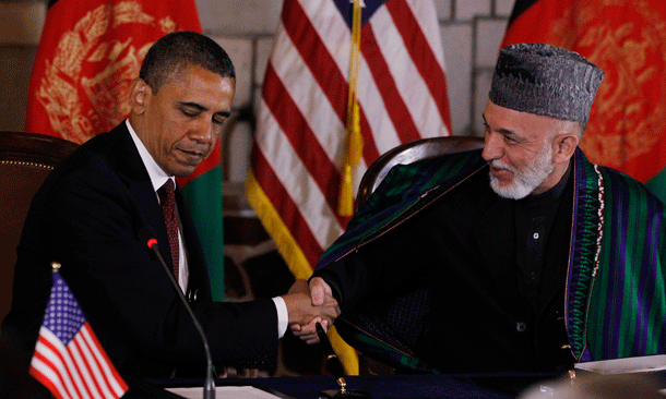 President Barack Obama and Afghan President Hamid Karzai shake hands after making statements before signing a strategic partnership agreement at the presidential palace in Kabul, Afghanistan. (AP/Charles Dharapak)