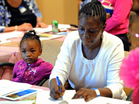 Rozeann Gorman, of Minneapolis, registers for a free screening at North Point Health & Wellness Center. (AP/Craig Lassig)