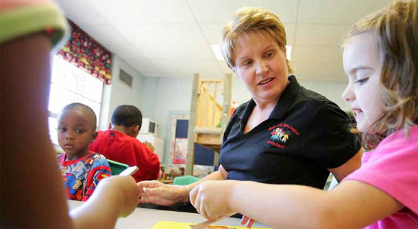 A preschool teacher helps a 4-year-old with her puzzle at Bellwood Discovery School in Murfreesboro, Tennessee. Observation in early childhood education has implications for  administrative decisions, evaluation practices, and policymaking in K-12. (AP/John Russell)