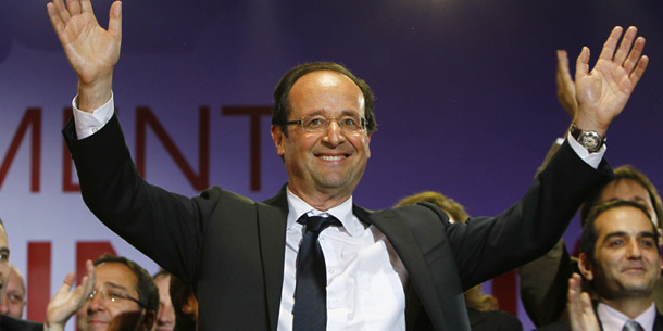 French President-elect François Hollande waves to crowds gathered to celebrate his election victory in Bastille Square in Paris, France, Sunday, May 6, 2012. (AP/Francois Mori)