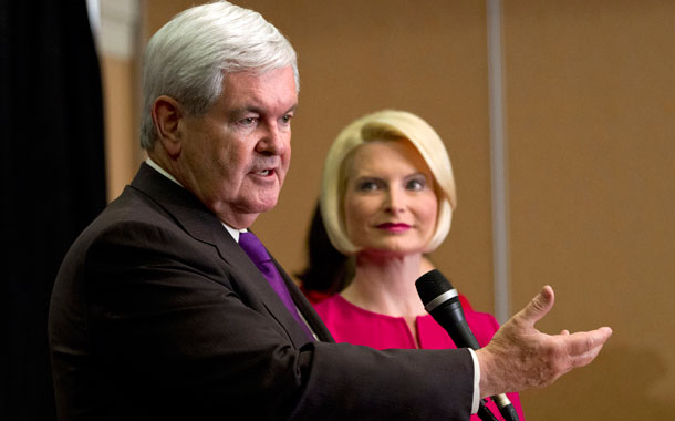 Callista Gingrich looks on as Newt Gingrich speaks at an event in Virginia earlier this year. Newt Gingrich has previously used the so-called Gingrich-Edwards loophole, which allows certain well-heeled professionals to avoid paying Medicare taxes on income. (AP/Evan Vucci)
