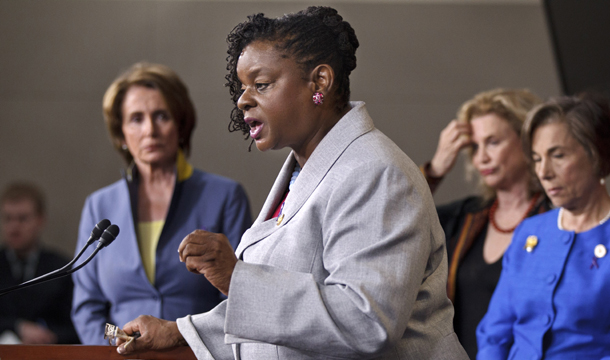 Rep. Gwen Moore (D-WI) gestures during a news conference on Capitol Hill in Washington, Wednesday, May 16, 2012, to push for the unrestricted reauthorization of the Violence Against Women Act. From left are House Minority Leader Nancy Pelosi (D-CA), Moore, Rep. Carolyn B. Maloney (D-NY), and Rep. Janice D. Schakowsky (D-IL). (AP/J. Scott Applewhite)