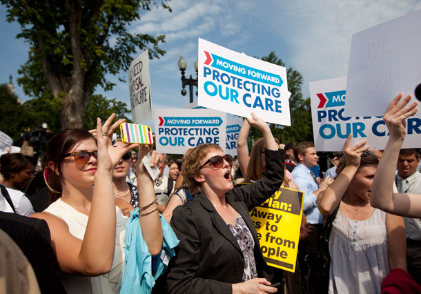 Demonstrators react to the Supreme Court landmark decision on health care on Thursday, June 28, 2012, outside the Supreme Court in Washington, D.C. (AP/Evan Vucci)