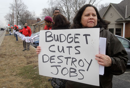 Pam Washington pickets against proposed cuts in the federal budget outside the local offices of House Speaker John Boehner in West Chester, Ohio. (AP/ Al Behrman)