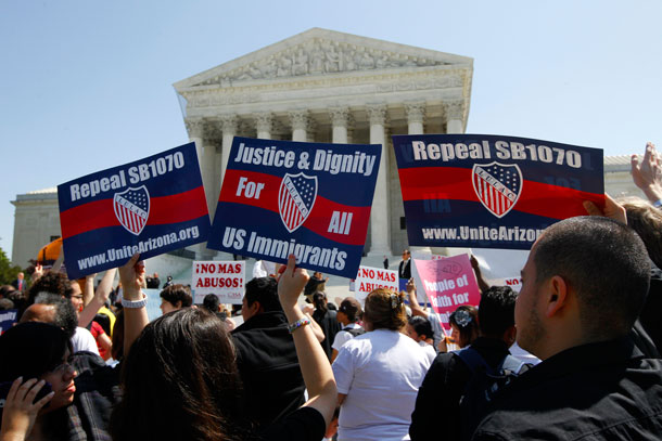 Supporters of immigration reform rally outsode the Supreme Court in Washington, D.C. on April 25, 2012, where the court held a hearing on Arizona's S.B. 1070. (AP/ Charles Dharapak)