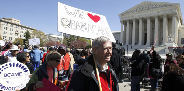 Holding a sign saying 