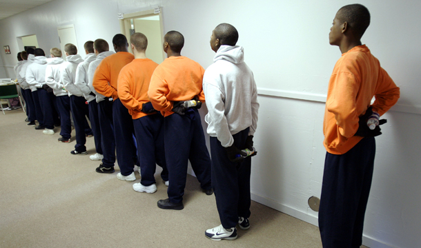 Inmates at the Department of Youth Services juvenile boot camp wait to go outside for physical training in Prattville, Alabama. (AP/Rob Carr)