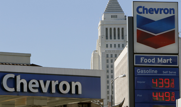 Gas prices are digitally displayed at a Chevron gas station in downtown Los Angeles, Thursday, January 26, 2012. (AP/Damian Dovarganes)