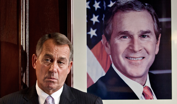 House Speaker John Boehner (R-OH) stands next to a portrait of former President George W. Bush as he waits to speak with reporters on Capitol Hill in Washington, Tuesday, July 24, 2012, following a House GOP caucus meeting. (AP/J. Scott Applewhite)