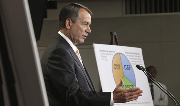 House Speaker John Boehner (R-OH) gestures during a news conference on Capitol Hill in Washington, Tuesday, July 19, 2011, to discuss last year's debt limit crisis. The economy slowed to 1.3 percent growth in the third  quarter of 2011 from 2.5 percent in the second quarter as the debt limit  fight further unsettled skittish businesses and left consumers  questioning whether lawmakers could be trusted to take the right policy  actions to ensure a strong American economy. (AP/J. Scott Applewhite)