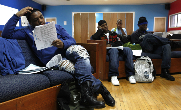 Donnie Dawson, 20, left, attends a youth advocacy group meeting at the Ruth Ellis Center, a drop-in shelter for gay and transgender youth in Detroit. A new report shows that youth homeless shelters do not have adequate resources to serve gay and transgender youth. ((AP/ Paul Sancya))