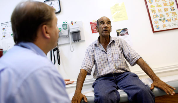 Patient Luis Gutierrez, right, talks with Dr. Javier Hiriart at Camillus Health Concern, a private, nonprofit organization that provides health care to the homeless and poor in Miami-Dade County, Florida. Republicans in at least three states want to abandon an expansion of Medicaid in President Barack Obama's health care overhaul.<br /> (AP/Lynne Sladky)