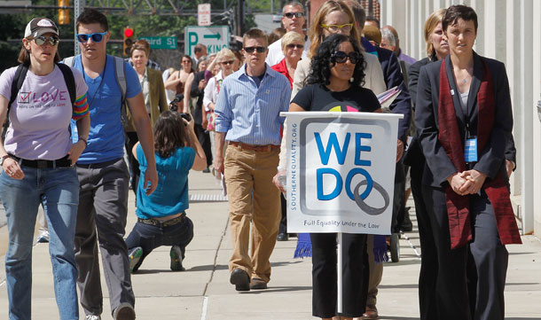 A group supporting the Campaign for Southern Equality march to the Forsyth County Register of Deeds office in Winston-Salem, North Carolina, to try and obtain marriage licenses for gay and lesbian couples. Polls show the majority of Americans support marriage equality.<br /> (AP/Bob Leverone)