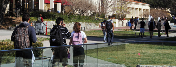 Students walk through the campus of Claremont McKenna College in Claremont, California.  Going forward, it is imperative that states  and the federal government continue to explore performance-based funding  options for higher education, particularly in the context of a series of outcomes-focused reforms. (AP/Reed Saxon)