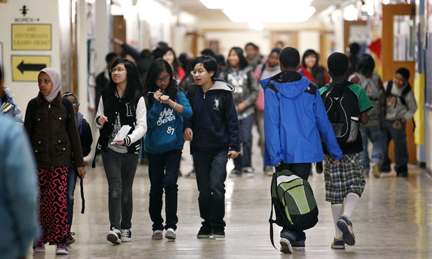 (Students in middle school hallway)