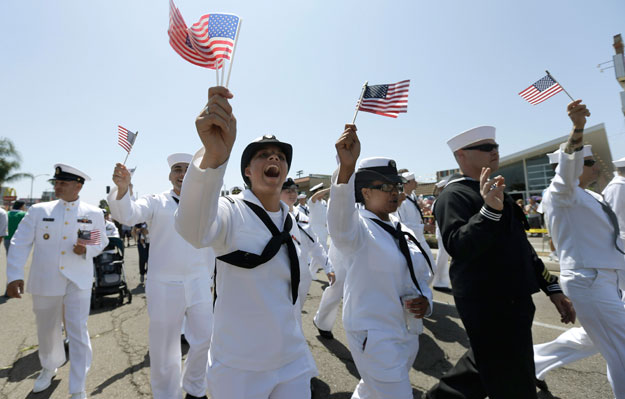 Sailors march in uniform during the gay pride parade in San Diego. Now that Don't Ask, Don't Tell has been repealed, we must do more to ensure nondiscriminatory policies are in place for our gay and transgender veterans. (AP/Gregory Bull)