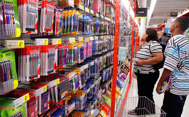 Parents and students shop for back-to-school supplies. America must invest more in its education system and in its students of color if the next generation is going to be competitive and prepared to enter the global workforce. (AP/Seth Perlman)