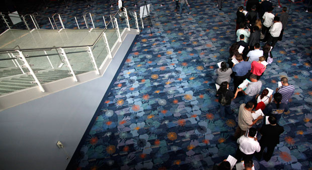 Job seekers wait in line at a job fair expo in Anaheim, California. (AP/Jae C. Hong)