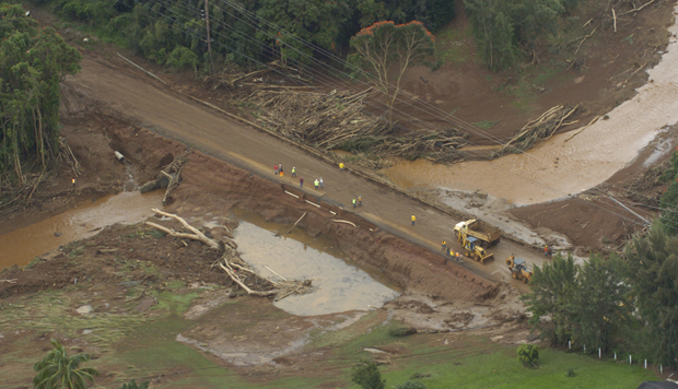 A highway wiped out after the Kaloko Reservoir Dam burst near Kilauea, Hawaii, is shown Tuesday, March 14, 2006. (AP/Bruce Asato)