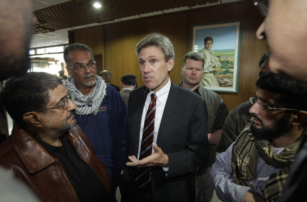 In this photo taken Monday, April 11, 2011, then-U.S. envoy Chris Stevens speaks to local media before attending meetings at the Tibesty Hotel where an African Union delegation was meeting with opposition leaders in Benghazi, Libya. (AP/Ben Curtis)