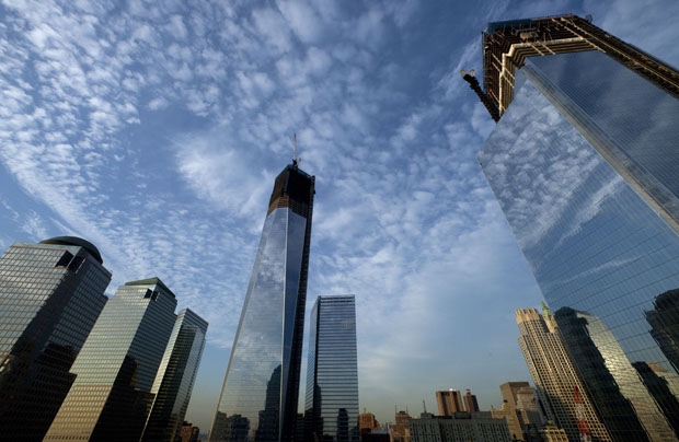 One World Trade Center, center, rises above the National September 11 Memorial and Museum at the World Trade Center, Thursday, September 6, 2012, in New York. (AP/Mark Lennihan)