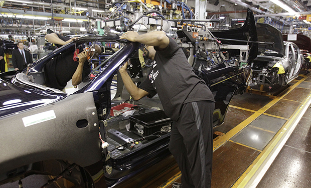 An assemblyman works on the line building Chrysler 200 vehicles at the Sterling Heights Assembly Plant in Sterling Heights, Michigan. (AP/Carlos Osorio)