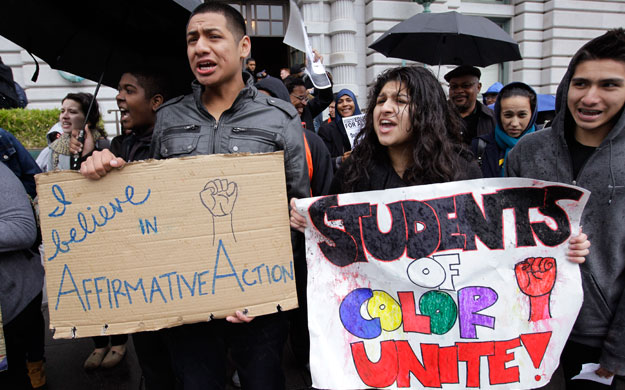 Sid Jacobo, left, and Jazel Flores, right, protest outside of the U.S. 9th Circuit Court of Appeals after a panel heard arguments in San Francisco earlier this year. The Supreme Court this week will hear arguments in an affirmative action case. (AP/Paul Sakuma)