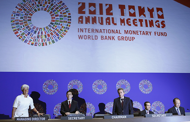 International Monetary Fund Managing Director Christine Lagarde, left, IMF Corporate Secretary Lin Jianhai, second left, Boards of Governors Chairman Riad Salameh, center, World Bank Group Corporate Secretary Jorge Familiar, second right, and World Bank Group President Jim Yong Kim arrive for the annual meetings plenary of IMF and World Bank Group in Tokyo, Friday, October 12, 2012. (AP/Koji Sasahara)