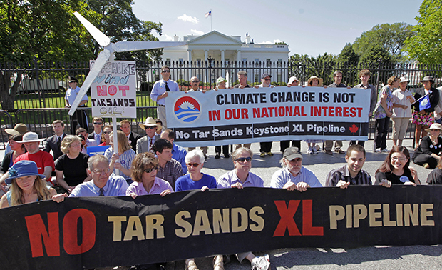 Environmental activists gather outside the White House in Washington, Monday, August 22, 2011, as they continue a civil disobedience campaign against the proposed Keystone XL oil pipeline from Canada to the U.S. Gulf Coast. (AP/J. Scott Applewhite)