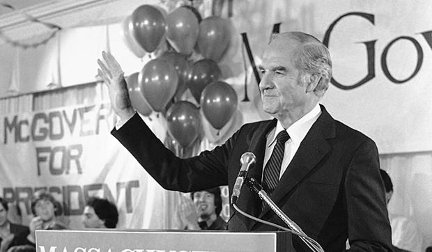 In this March 13, 1984, file photo, former Sen. George S. McGovern waves to supporters as he appears at his campaign headquarters in Boston, as results of the Massachusetts presidential preference primary were tallied. (AP/Peter Southwick)