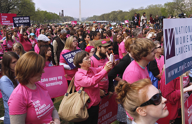 People rally in support of Planned Parenthood on the National Mall in Washington, Thursday, April 7, 2011. Title X provides federal funds to states to administer family planning services, but some states have targeted Planned Parenthood and any other providers that offer abortion services, even though they provide those abortion services with nongovernment funds. (AP/Jacquelyn Martin)