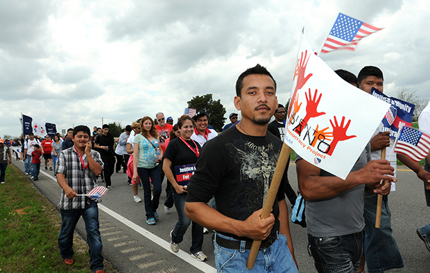 Pedro Contrera, an immigrant from Vera Cruz, Mexico, and resident of Birmingham, Alabama, protests H.B. 56, Alabama's immigration law, while marching in the Selma to Montgomery Voting Rights March re-enactment, Thursday, March 8, 2012, in Montgomery, Alabama. (AP/Julie Bennett)