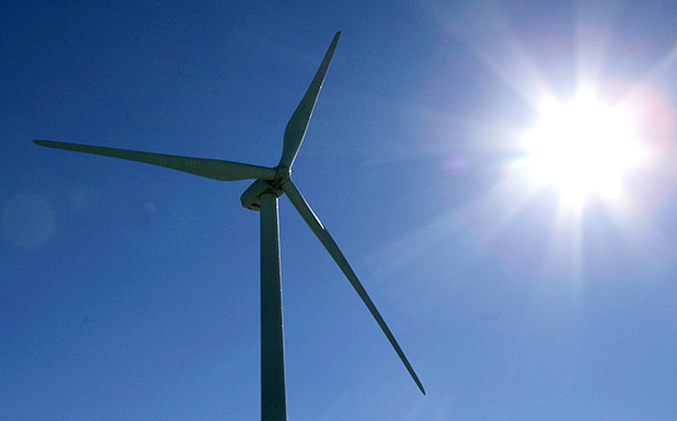 The sun is reflected off of a wind turbine at a wind farm near Peetz, Colorado. (AP/Ed Andrieski)