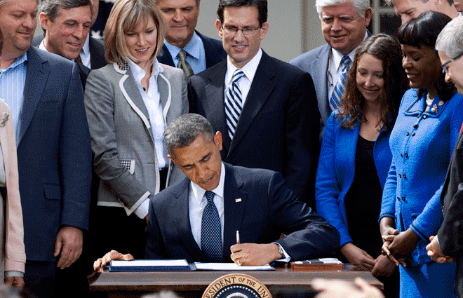 Barack Obama signs the Jumpstart our Business Startups (JOBS) Act, in the Rose Garden of the White House In April, 2012, as Lawmakers, including Republican Eric Cantor, look on. The JOBS Act includes a provision that allows companies to sell stock to a larger number of investors without going through the hassle and cost of registering with the Securities and Exchange Commission. (AP Photo/Carolyn Kaster)