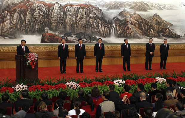Chinese Communist Party General Secretary Xi Jinping, left, speaks as other new members of the Politburo Standing Committee, from second left, Zhang Gaoli, Liu Yunshan, Zhang Dejiang, Li Keqiang, Yu Zhengsheng, and Wang Qishan, stand in Beijing's Great Hall of the People, Thursday, November 15, 2012. (AP/Vincent Yu)