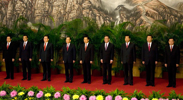 Communist Party General Secretary and Chinese President Hu Jintao, center, stands with the current members of the Politburo Standing Committee in Beijing's Great Hall of the People in 2007. The 18th Communist Party Congress meeting next week will usher in a new cadre of leaders of the Standing Committee who will be in office until 2017. (AP/Ng Han Guan)