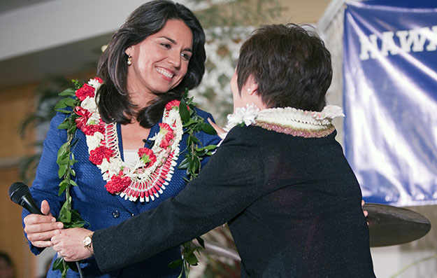 Democrat Colleen Hanabusa, right, congratulates candidate Tulsi Gabbard after both women won their Hawaii Congressional district seats at the Japanese Cultural Center in Honolulu, Tuesday, November 6, 2012. Gabbard, 31, is the first Hindu to win an election for Congress, where she will also be the first member born in the U.S. territory of American Samoa. (AP/Marco Garcia)