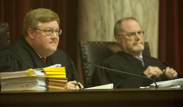 Acting Chief Justice Brent Benjamin, left, and Judge Fred Fox listen to arguments in a rehearing of a $76 million judgment awarded to Harman Mining Co. against Massey Energy Co. before the West Virginia Supreme Court of Appeals at the West Virginia State Capitol Complex in Charleston, West Virginia, Wednesday, March 12, 2008. (AP/Bob Bird)