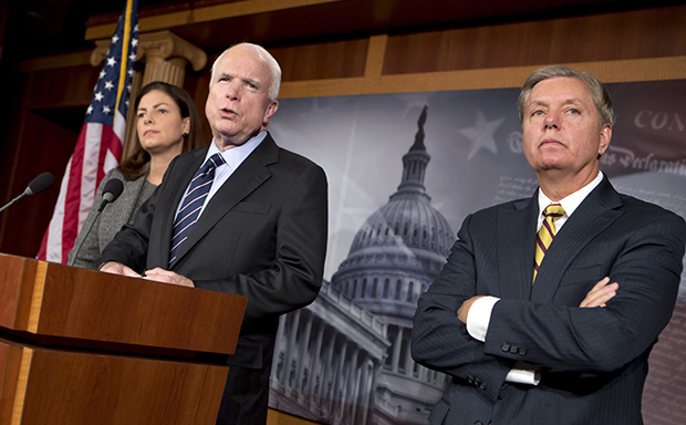 Sen. John McCain (R-AZ), center, accompanied by Sen. Kelly Ayotte (R-NH), left, and Sen. Lindsey Graham (R-SC), speaks during a news conference on Capitol Hill, Wednesday, November 14, 2012. Sens. McCain and Graham's criticism of U.N. Ambassador Susan Rice has harmed the reputation of the Republican Party with black voters. (AP/J. Scott Applewhite)