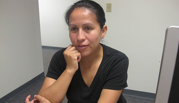 Elizabeth Garcia of Mahomet, Illinois, talks about how she uses supplemental nutrition assistance to feed her three children during a visit to the state Department of Human Services in Champaign, Illinois. (AP/David Mercer)