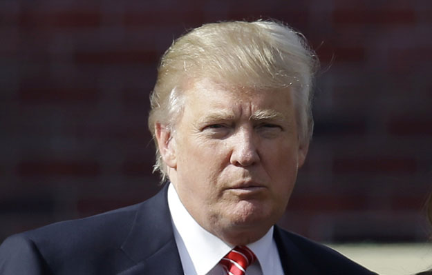 Donald Trump arrives for the opening ceremony at the Ryder Cup PGA golf tournament at the Medinah Country Club in Medinah, Illinois. Trump has deleted some of the Twitter tirade he posted following President Barack Obama's reelection and added new critiques of NBC's Brian Williams. (AP/David J. Phillip)