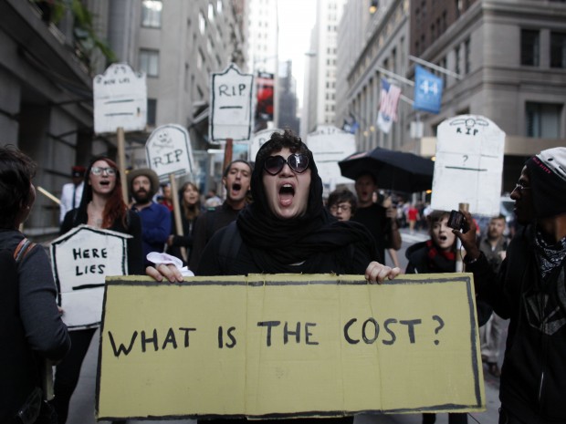 An offshoot of Occupy Wall Street has turned to ancient religious teachings to take on America's mounting consumer debt. (AP/ Jason DeCrow)