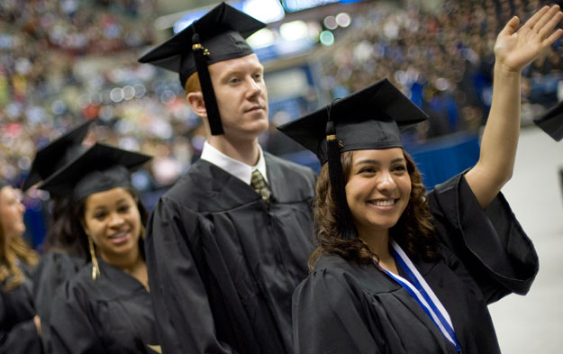 A group of students walks into an auditorium to attend University of Connecticut's 2012 graduation ceremonies. College education rates, among other factors laid out in this report, are signs of economic mobility and opportunity. (AP/Jessica Hill)