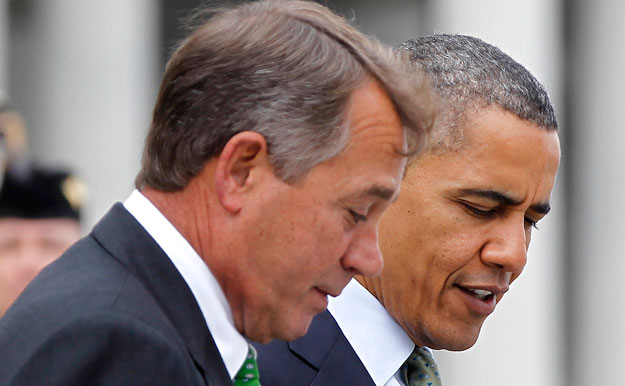 President Barack Obama talks with House Speaker John Boehner (R-OH) on Capitol Hill. Congress must extend unemployment insurance despite the ongoing fiscal showdown and budget cuts that will likely take effect in January. (AP/Pablo Martinez Monsivais)