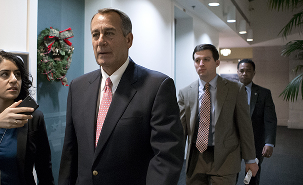 Speaker of the House John Boehner (R-OH) walks to a closed-door GOP caucus as Congress meets to negotiate a legislative path to avoid the so-called fiscal cliff of automatic tax increases and deep spending cuts that could kick in January 1, at the Capitol in Washington, Sunday, December 30, 2012. (AP/J. Scott Applewhite)