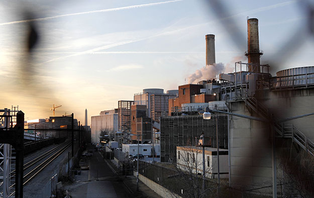 The 99-year-old Capitol Power Plant that heats and cools the hallowed halls of Congress is seen through a fence in Washington on Wednesday, February 25, 2009. (AP/Jacquelyn Martin)