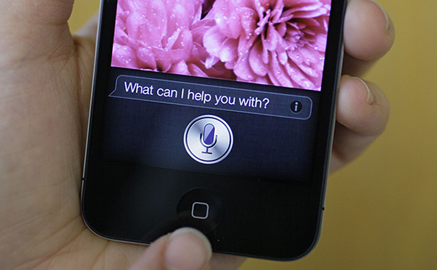 Siri, the iPhone virtual assistant, is displayed on the Apple iPhone 4S in San Francisco, Monday, October 10, 2011. Siri, among other modern mobile communications technologies, can trace its roots back to government research in national labs and at the Defense Advanced Research Projects Agency, or DARPA. (AP/Eric Risberg)