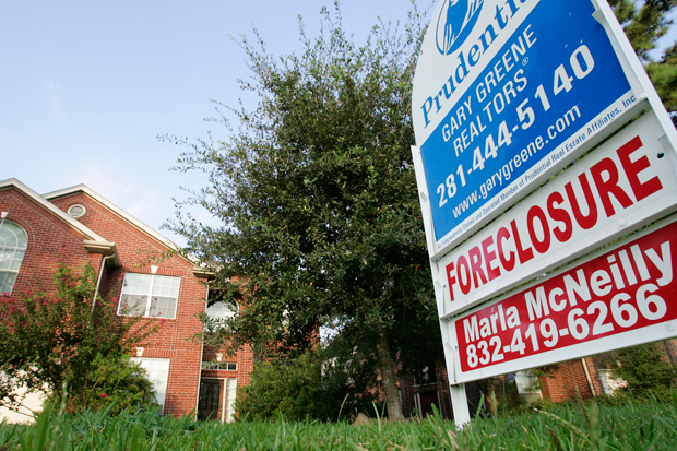 A foreclosed home for sale in Spring, Texas. A congressional refusal to lift the debt ceiling will increase housing costs and depress the market. (AP/ David J. Phillip)