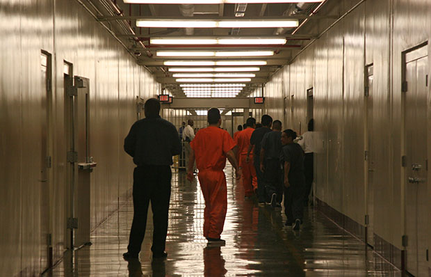 Detainees at Immigration and Customs Enforcement's Stewart Detention Center in Lumpkin, Georgia, leave the cafeteria after lunch to go back to their living units. Gay and transgender immigrants can face particularly harsh treatment in detention centers. (AP/Kate Brumback)