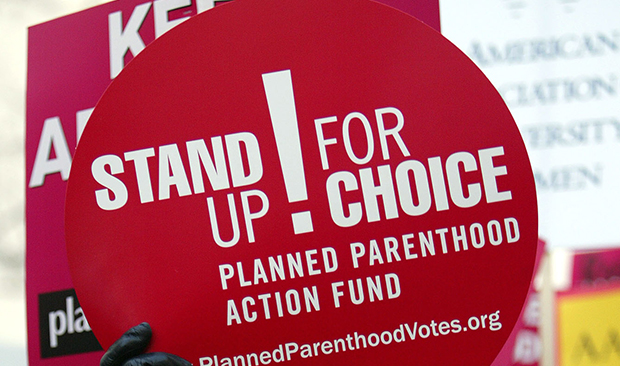 Activists hold up signs during an abortion rights rally in San Francisco. (AP/Jeff Chiu)